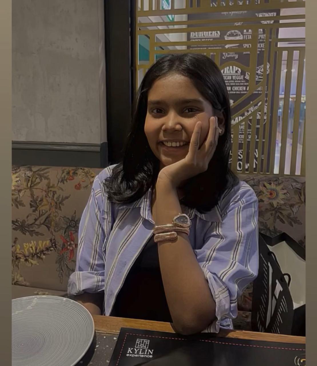 Vridhi Kumar smiling at a restaurant