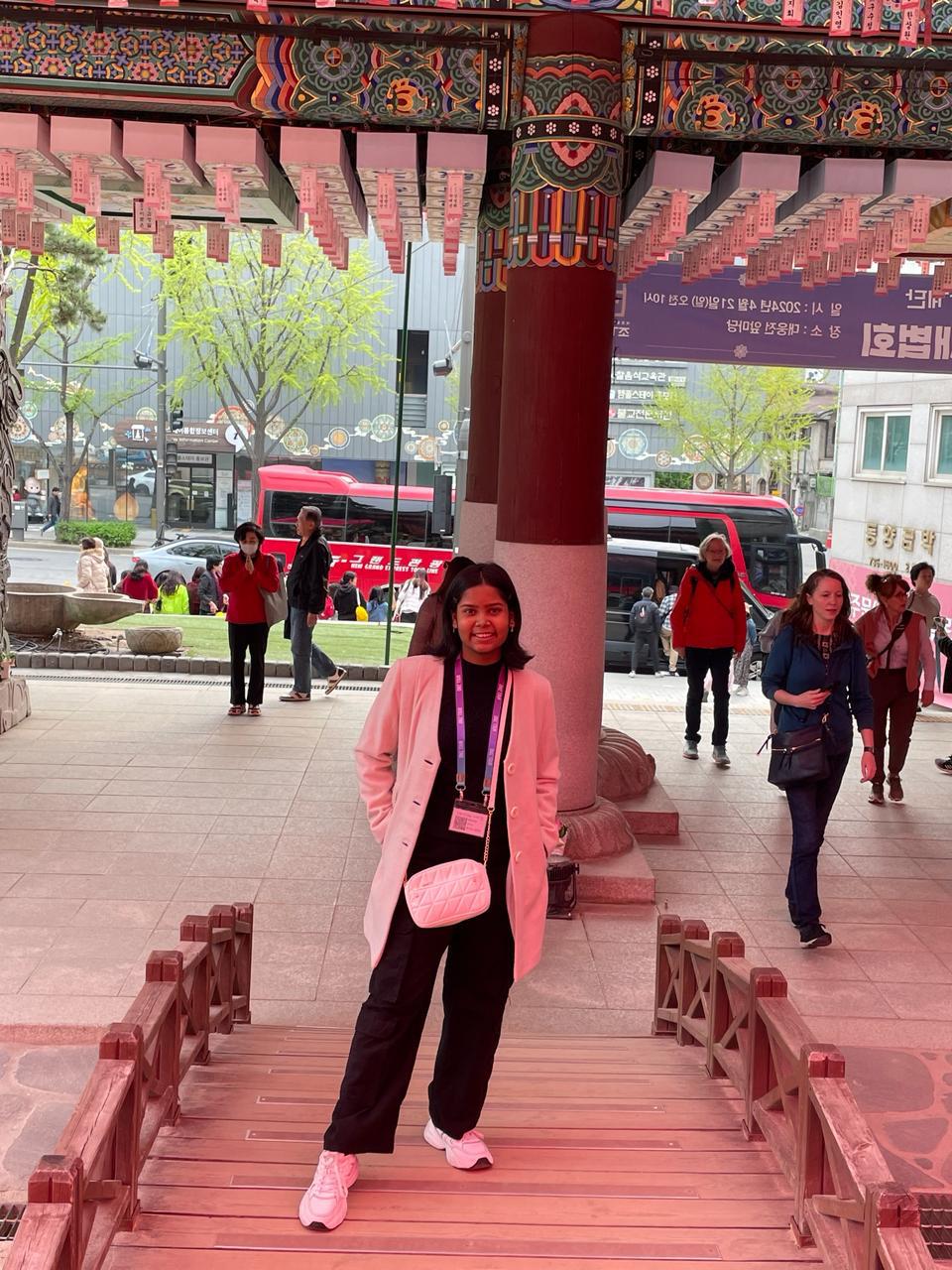 Vridhi Kumar at a temple entrance in South Korea